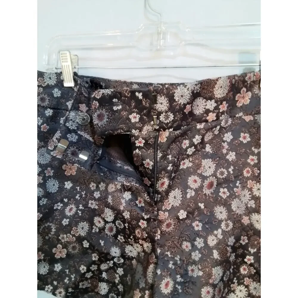 Gray tapestry shorts. Silver and rusty flowers on black background